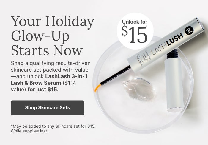 Holiday skincare promotion featuring LashLash 3-in-1 Lash & Brow Serum on a clear dish with gel, highlighting limited-time $15 offer ($114 value) when purchased with qualifying skincare sets.